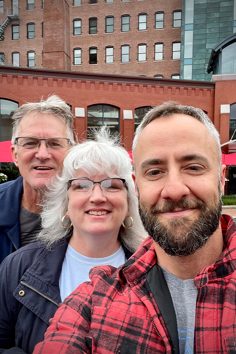 David with his foster parents, Holly and Steven