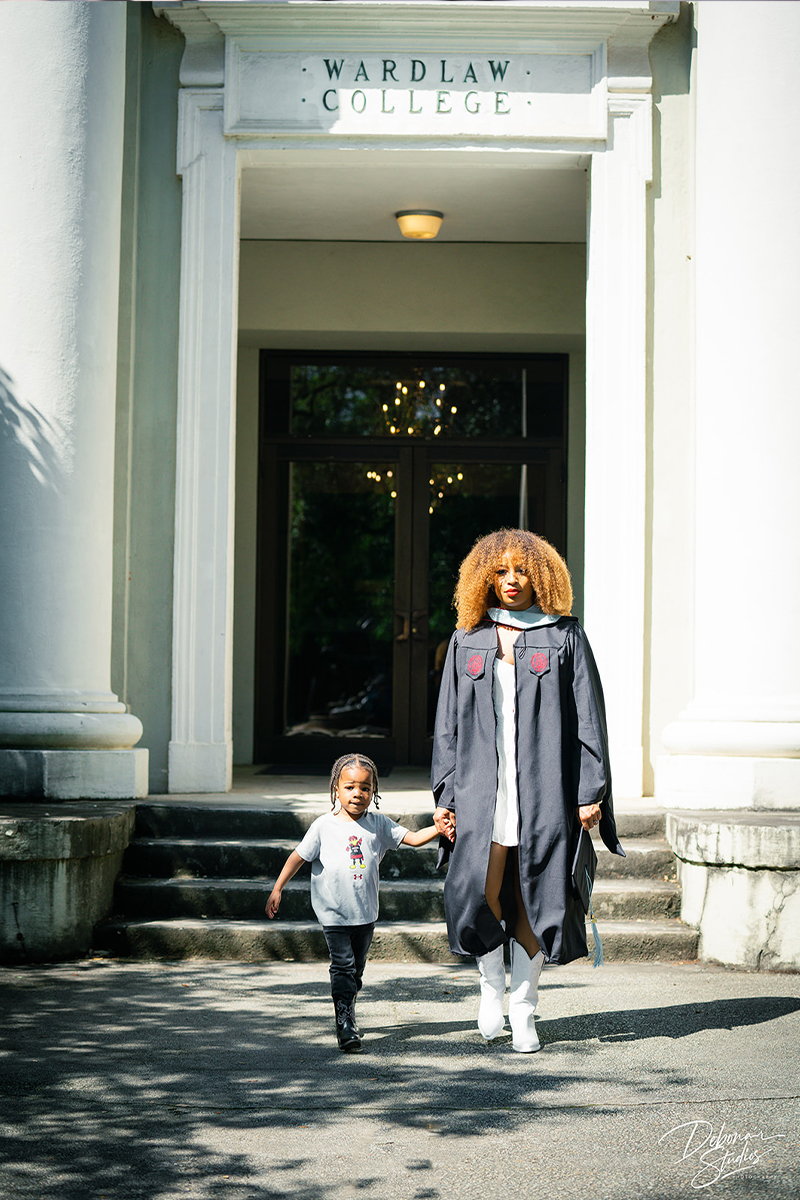 Natasha and her son, Liam, in front of the College of Education at the University of South Carolina, where she earned her EdS in counselor education