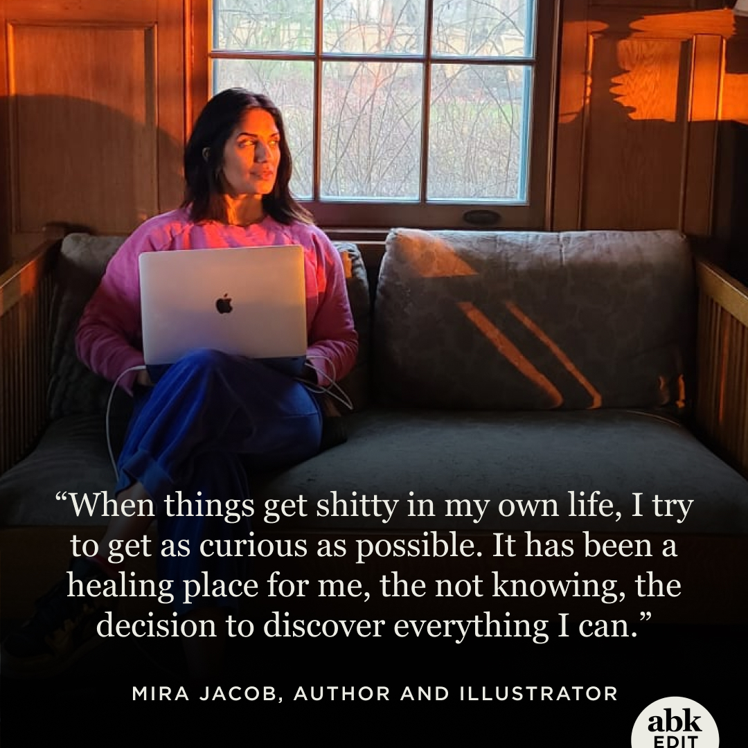 Mira Jacob sitting on a couch with her laptop during golden hour with the quote “When things get shitty in my own life, I try to get as curious as possible. It has been a healing place for me, the not knowing, the decision to discover everything I can.”