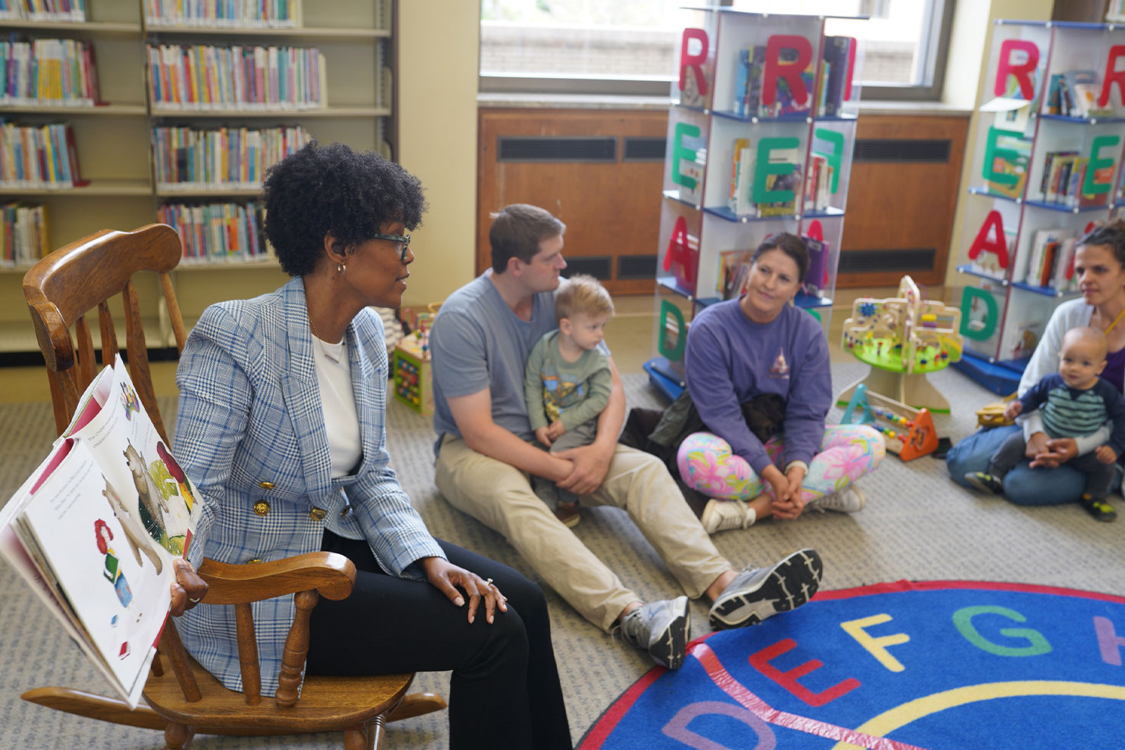 Maya reads to children and parents at the Richmond Public Library in Virginia