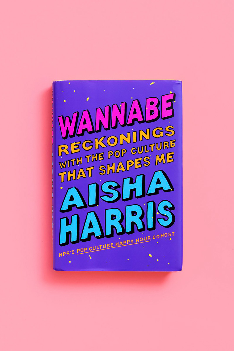 The cover of Aisha Harris's book, WANNABE: RECKONINGS WITH THE POP CULTURE THAT SHAPES ME. The cover is purple with the text in hot pink and turquoise block lettering.