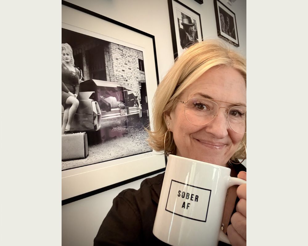 Brené Brown holding mug sober AF